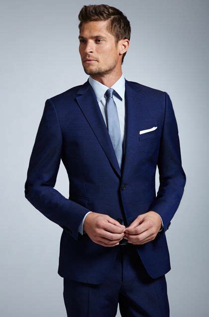 navy blue suit with light blue tie